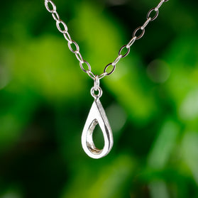 Handmade sterling silver teardrop pendant. A meaningful gift of hope—15% donated to LLS to fund cancer research and support patients.