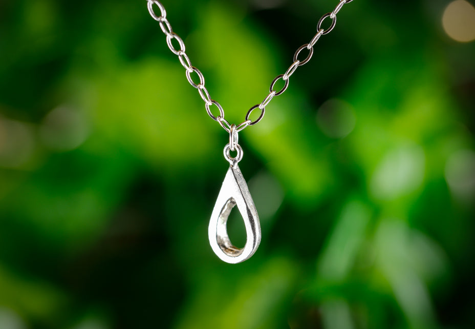 Handmade sterling silver teardrop pendant. A meaningful gift of hope—15% donated to LLS to fund cancer research and support patients.