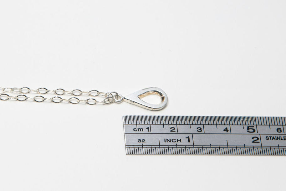 Meaningful silver teardrop necklace. Elegant hammered pendant with purpose—15% donated to LLS. Jewelry that gives back with every purchase.