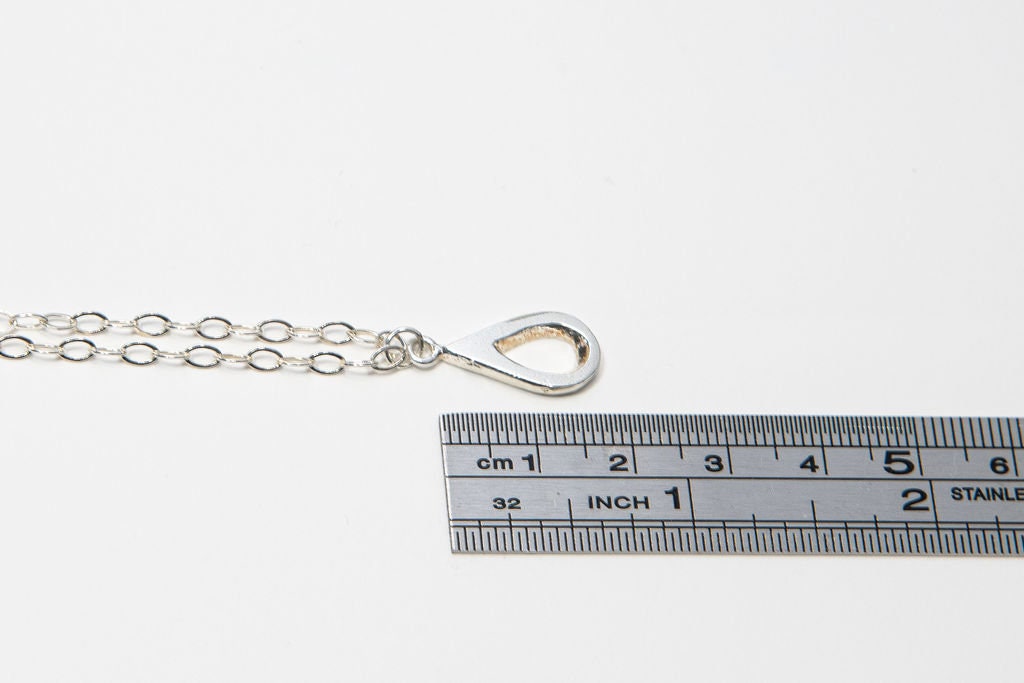 Meaningful silver teardrop necklace. Elegant hammered pendant with purpose—15% donated to LLS. Jewelry that gives back with every purchase.