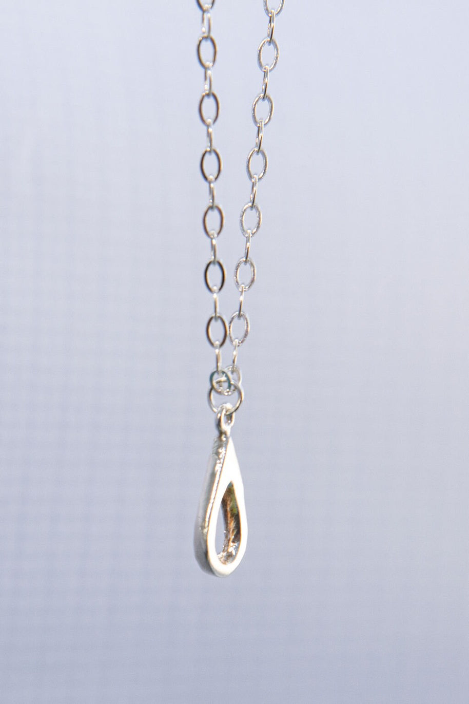 Meaningful silver teardrop necklace. Elegant hammered pendant with purpose—15% donated to LLS. Jewelry that gives back with every purchase.