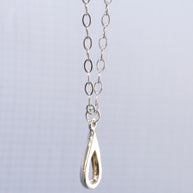 Meaningful silver teardrop necklace. Elegant hammered pendant with purpose—15% donated to LLS. Jewelry that gives back with every purchase.